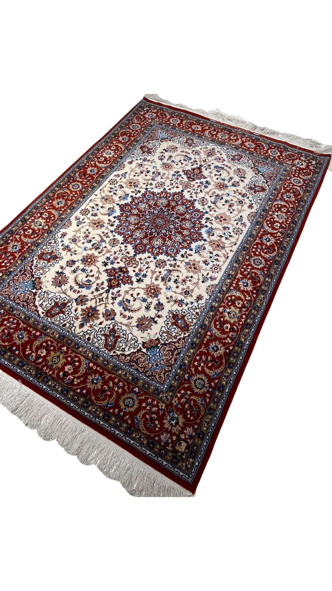 "Hand-knotted Persian rug with detailed central medallion and red borders by Hojeh Froosh."